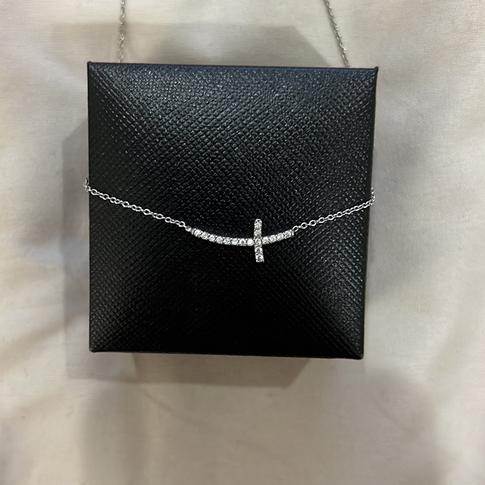 Dainty stainless steel cross necklace.